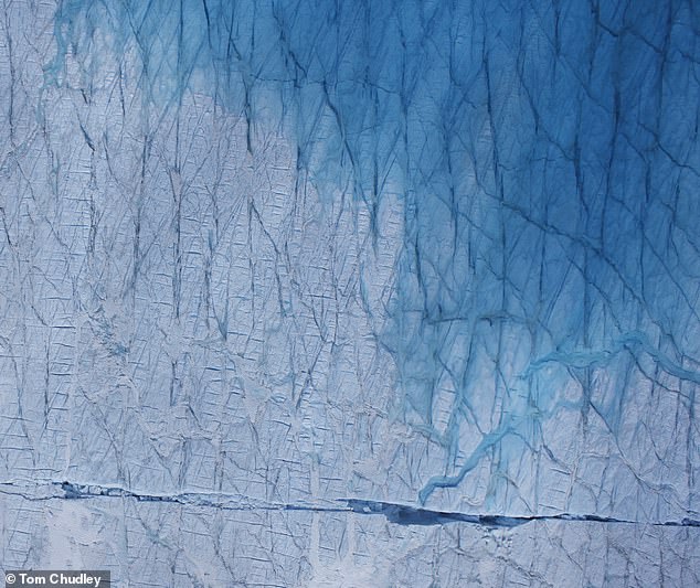 But many of these lakes drain quickly to the bottom, falling through the cracks and large fractures that form in the ice (pictured)