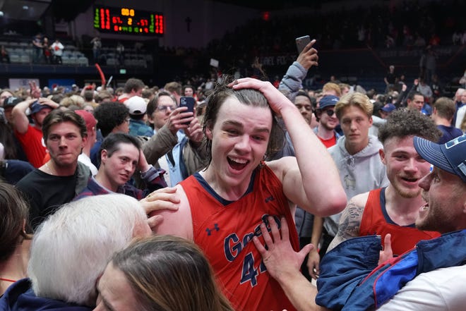 St Mary's goalkeeper Alex Ducasse celebrates Giles' victory with the crowd after the game against Gonzaga.