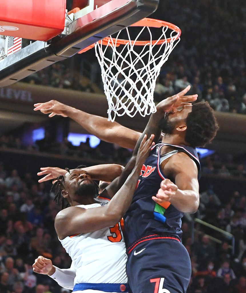 Knicks forward Julius Randle is stopped by 76ers player Joel Embiid during the first half of a game on Sunday, February 27, 2022, at Madison Square Garden.