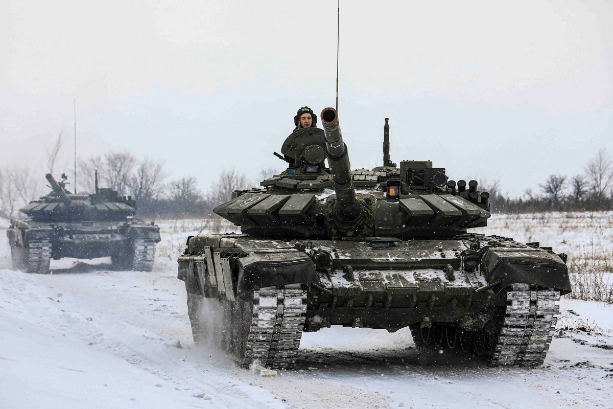 Russian soldiers drive tanks during military exercises in the Leningrad region, Russia, in this photo posted on February 14, 2022. Russian Ministry of Defense / Posted via Reuters / File photo