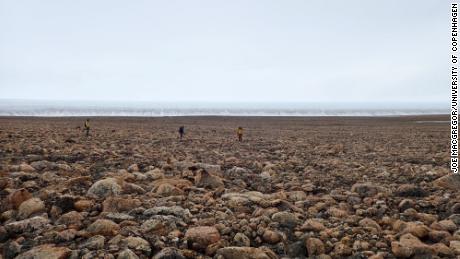 Researchers collected sand and rock samples at Greenland to determine when the meteorite fell. 