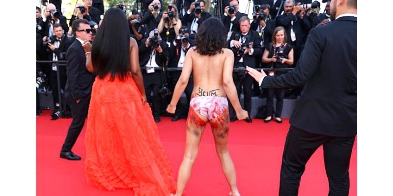 An Naked Female Protester Crashes The Red Carpet At Cannes Film Festival 
