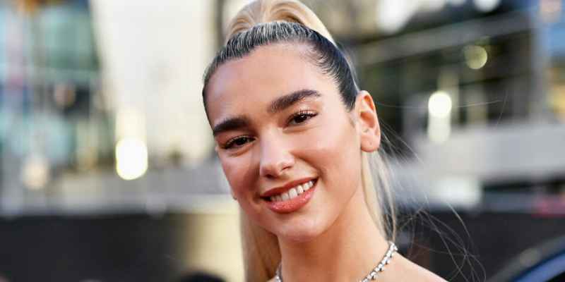 Dua Lipa Brings Back Punk Style To Sweden in Hooked Heavy Metal Mini Skirt & Knee-High Boots