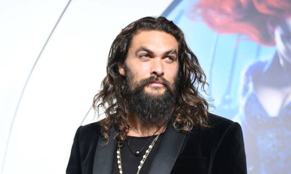 Jason Momoa Is All Smiles With A Black-on-black Suit On The Red Carpet 